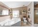 The bathroom has a deep soaking tub, tiled flooring, and a neutral color scheme at 5425 Creek Run Ct, Kings Mountain, NC 28086