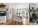 Inviting dining room with a charming fireplace, bright natural light, and a classic dining set for Gathering gatherings at 5425 Creek Run Ct, Kings Mountain, NC 28086