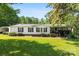 Charming single-story home with well-maintained lawn, white siding, black shutters, and inviting front porch at 5425 Creek Run Ct, Kings Mountain, NC 28086