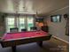 Billiards table in the recreation room with natural light and charming decorations at 5425 Creek Run Ct, Kings Mountain, NC 28086