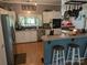 Open kitchen featuring white cabinets, modern appliances, and a breakfast bar with seating at 5425 Creek Run Ct, Kings Mountain, NC 28086