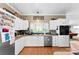 Well-equipped kitchen featuring white cabinetry, modern appliances, and ample counter space perfect for cooking at 5425 Creek Run Ct, Kings Mountain, NC 28086