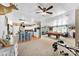Open-concept living area with a kitchen island, billiards table, and exercise equipment, offering diverse recreational spaces at 5425 Creek Run Ct, Kings Mountain, NC 28086