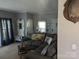 Comfortable living room with a large sectional couch, rustic wood coffee table, and decor at 5425 Creek Run Ct, Kings Mountain, NC 28086