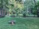 Peaceful pond view featuring a quaint bench overlooking calm water and green surroundings at 5425 Creek Run Ct, Kings Mountain, NC 28086