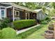 Charming home with a covered porch, tidy landscaping, and a welcoming entrance at 5916 Indian Brook Dr, Matthews, NC 28104