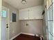 Mudroom offers great storage in upper cabinets and access to the garage and backyard at 5916 Indian Brook Dr, Matthews, NC 28104