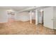 The expansive basement boasts tile flooring, an open layout, and versatile space for customization and entertainment at 7008 Wannamaker Ln, Charlotte, NC 28226