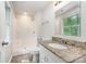 Updated bathroom with a granite-topped vanity and a stand up shower at 7008 Wannamaker Ln, Charlotte, NC 28226
