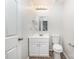This stylish bathroom features a modern sink, matching mirror, and efficient toilet, all in a compact space at 7008 Wannamaker Ln, Charlotte, NC 28226