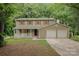 Charming two-story home with a cozy front porch, a two-car garage, and a well-maintained lawn at 7008 Wannamaker Ln, Charlotte, NC 28226