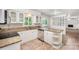 Charming kitchen featuring granite countertops, white cabinets, stainless dishwasher, and neutral tile flooring at 7008 Wannamaker Ln, Charlotte, NC 28226