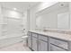 This bathroom includes granite countertops, modern cabinets, and a shower tub at 707 Olde England Dr, Lincolnton, NC 28092