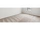 This bedroom features a bright window with light neutral carpet throughout at 707 Olde England Dr, Lincolnton, NC 28092