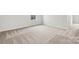 This bedroom has a light neutral carpet with a bright window at 707 Olde England Dr, Lincolnton, NC 28092