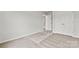 A cozy bedroom featuring neutral carpet and white trim on doors and baseboards at 707 Olde England Dr, Lincolnton, NC 28092