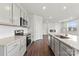Kitchen with granite countertops, stainless steel appliances, and hardwood floors, perfect for entertaining at 707 Olde England Dr, Lincolnton, NC 28092