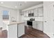 Modern kitchen featuring stainless steel appliances, granite countertops, and hardwood flooring at 707 Olde England Dr, Lincolnton, NC 28092