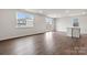 Spacious living room with hardwood floors, a large window, and glass doors to the backyard at 707 Olde England Dr, Lincolnton, NC 28092