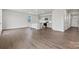 Bright living area with hardwood floors seamlessly connected to an open kitchen and dining space at 707 Olde England Dr, Lincolnton, NC 28092