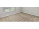 Bedroom showcases neutral carpeting, a large window for natural light, and a clean, minimalist design at 7311 Jerimoth Dr, Charlotte, NC 28215