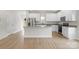 Modern kitchen with granite countertops, stainless steel appliances, a kitchen island, and ample cabinet space at 7311 Jerimoth Dr, Charlotte, NC 28215