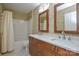 Bathroom with double sink vanity, framed mirrors and shower/tub combination at 7321 Harrisonwoods Pl, Charlotte, NC 28270