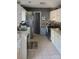 A well-maintained kitchen offers modern appliances, ample counter space, and neutral decor at 7401 Merrily Ln, Charlotte, NC 28214