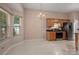 Well lit kitchen featuring stainless steel appliances, wooden cabinets, and adjacent breakfast area at 8002 Kingston Dr, Waxhaw, NC 28173