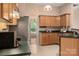 Traditional kitchen with wood cabinets, stainless steel refrigerator and ample counterspace at 8002 Kingston Dr, Waxhaw, NC 28173