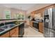 Bright kitchen featuring wood cabinets, stainless steel appliances, breakfast nook and modern decorative accents at 8002 Kingston Dr, Waxhaw, NC 28173