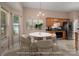 Bright kitchen featuring wood cabinets, stainless steel appliances, breakfast nook and modern decorative accents at 8002 Kingston Dr, Waxhaw, NC 28173