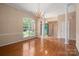Open living room with hardwood floors, neutral walls, and natural light at 8002 Kingston Dr, Waxhaw, NC 28173