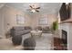 Bright living room featuring neutral tones, recessed lights, and a fireplace at 8002 Kingston Dr, Waxhaw, NC 28173