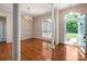 Bright living room with hardwood floors, columns, and large windows at 8002 Kingston Dr, Waxhaw, NC 28173