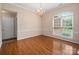 Elegant living room with hardwood floors and large window at 8002 Kingston Dr, Waxhaw, NC 28173