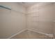Spacious walk-in closet featuring built-in shelving for optimal organization at 8002 Kingston Dr, Waxhaw, NC 28173