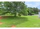 Picture of lush backyard with mature tree canopy that adds charm at 8904 Gerald Dr, Charlotte, NC 28217
