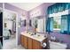 Lavender bathroom with double vanity, large mirror, and great lighting at 8904 Gerald Dr, Charlotte, NC 28217