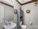 Half bath features neutral colors, vanity, and coordinated fixtures at 8904 Gerald Dr, Charlotte, NC 28217