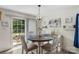 Bright dining area with natural light from sliding glass doors to outside at 8904 Gerald Dr, Charlotte, NC 28217