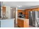 Updated kitchen features wood cabinets, stainless steel appliances, and an island at 8904 Gerald Dr, Charlotte, NC 28217