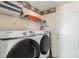 Practical laundry room with washer, dryer, and storage space at 8904 Gerald Dr, Charlotte, NC 28217