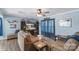 Relaxing living room with couches, ceiling fan, wood-look flooring, and entertainment center at 8904 Gerald Dr, Charlotte, NC 28217