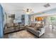 Inviting living room with plush couches, a ceiling fan, and wood-look flooring at 8904 Gerald Dr, Charlotte, NC 28217