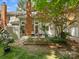 Backyard with a well-maintained patio, featuring lounge chairs and an attractive garden with plants and foliage at 9473 Kings Falls Dr, Charlotte, NC 28210