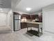Well-lit kitchen featuring stainless steel appliances, ample counter space, and modern finishes at 9473 Kings Falls Dr, Charlotte, NC 28210