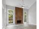 Living room with a vaulted ceiling, and a grand fireplace at 9473 Kings Falls Dr, Charlotte, NC 28210