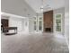 Spacious living room with a vaulted ceiling, fireplace and natural light at 9473 Kings Falls Dr, Charlotte, NC 28210
