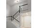 Beautiful staircase with white railings and dark wood accents leading to the upper level at 9473 Kings Falls Dr, Charlotte, NC 28210